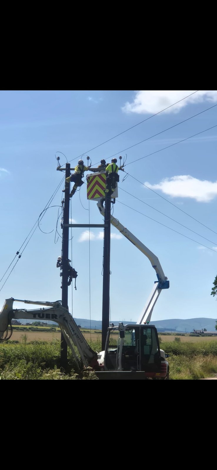LineTech crew in MEWP working on overhead lines